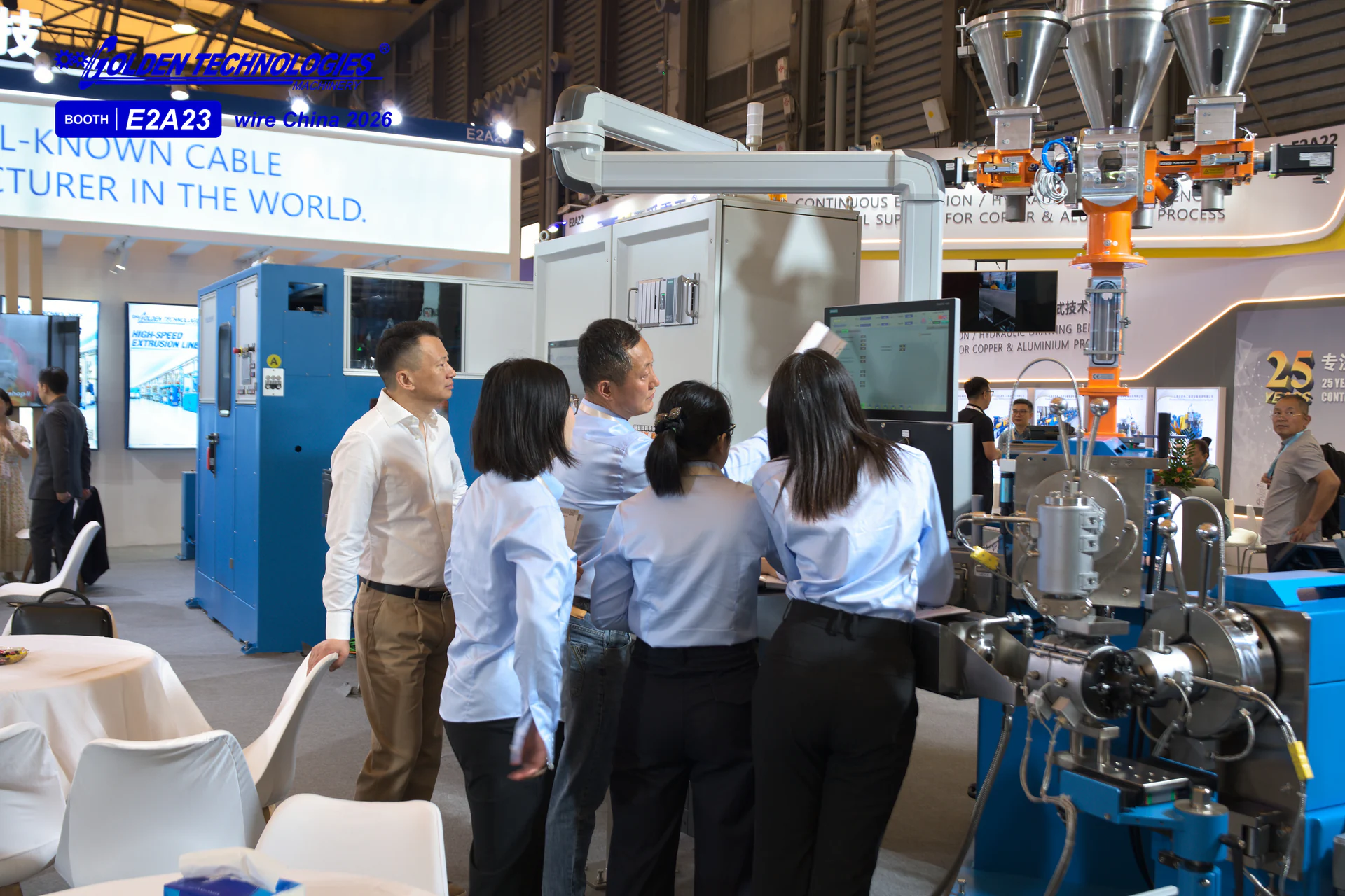 Golden Technologies engineers commissioning the system while the sales team observes at wire China 2026
